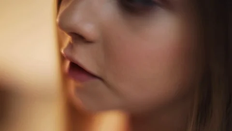 Face view of cute pink lips of young girl sings beautiful child baby face kid Stock Footage 98152556