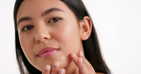 Face, woman and check patch for skincare in studio of pimple breakout, acne Stock Footage 316886050