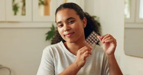 Face, woman and pimple patch in bathroom with skincare, blemish control and Video stock 330571349