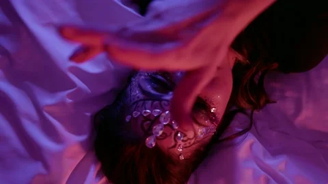 Face a woman with beautiful makeup, a pattern and with rhinestones on her face Stock Footage 147372055
