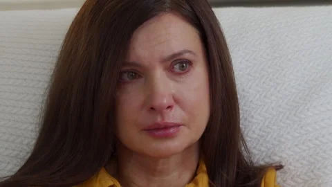 Face of worried woman crying while watching movie. Stock Footage 293683580