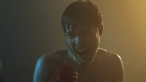 Face Of Young Boxer During Fight. Man Shouts And Strikes Hard. Video stock 160765062
