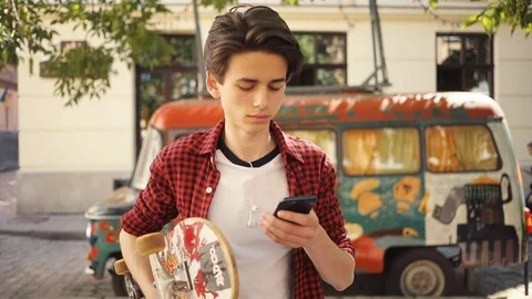 Face young boy use phone sitting smile guy business fashion hand child man Stock Footage 92050366