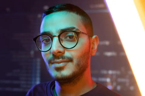 Face of young clever confident programmer or software developer in eyeglasses 스톡 사진