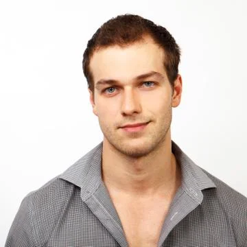 Face of young friendly man with nice smile Stock Photos