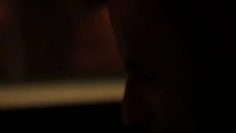 Face of a young guy in the dark Stock Footage 77383862