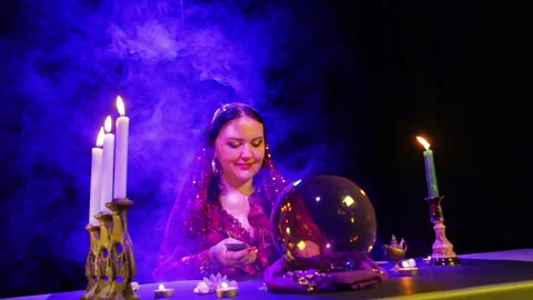 The face of a young gypsy fortune-teller with cards Stock Footage 105748144
