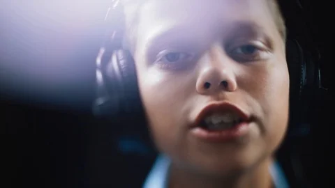 Face young handsome singer boy writing song in the studio male music mic Stock Footage 98216787