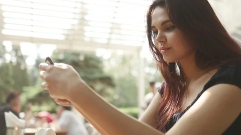 Face young smiling charming brunette beautiful woman with long hair use Stock Footage 98246540