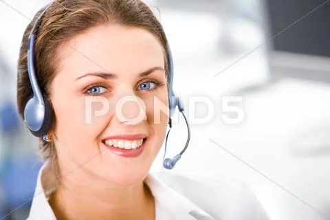 Face of young smiling confident woman with headset Stock-Fotos