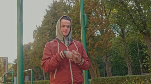 Face Of Young Sports Guy With . Guy Is Standing On The Street. Young Athletic Stock Footage 141768154