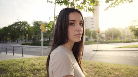 Face young woman looking at camera serious. Concentrated lady with emotional Stock Footage 219723404