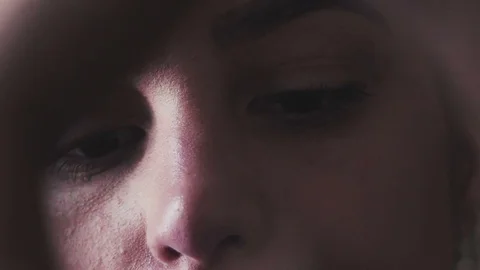 The face of a young woman in the process of work. Physiognomy Stock Footage 74612549