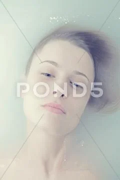 Face young woman in troubled waters Stock Photos