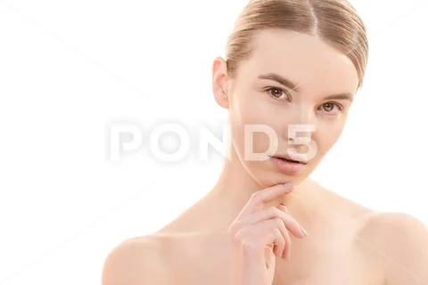 The face of the young woman on the white background Stock Photos