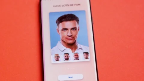 The Faceapp mobile application is launched on the smar Stock Footage 151683660
