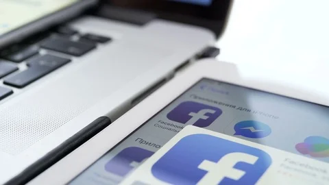 Facebook application on the iPad, iPhone and Macbook gadgets Stock Footage 81209759