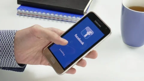 The Facebook application is loaded for a very long time Stock Footage 99834499