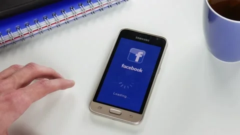 The Facebook application takes a very long time to load Stock Footage 99837447