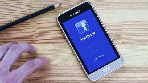 The Facebook application takes a very long time to load Stock Footage 106630899