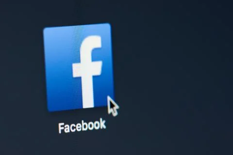 Facebook icon on screen Stock Photos