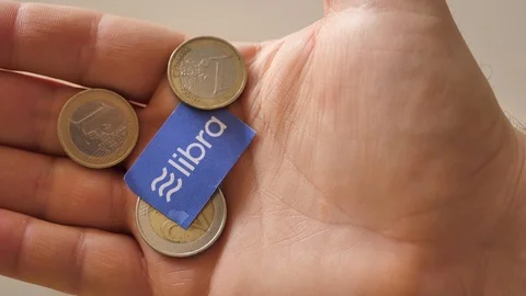 Facebook Libra cryptocurrency and coins Stock Footage 112654679