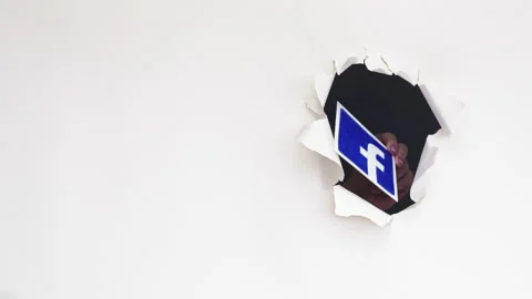 Facebook logo influencer hand mobile app hole Video stock 140901707