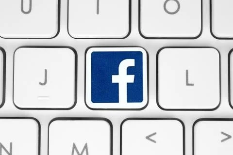 Facebook logo placed on white computer keyboard Stock Illustration