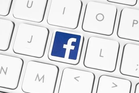 Facebook logo white computer keyboard Stock Photos
