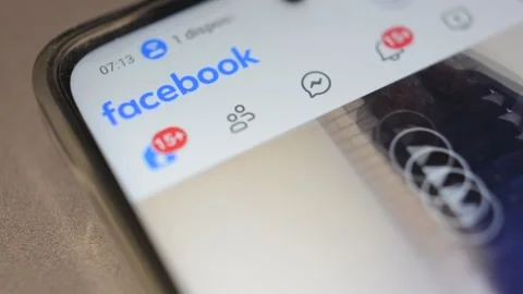 Facebook social network app on iphone screen. fb social media by meta. Video stock 299896869