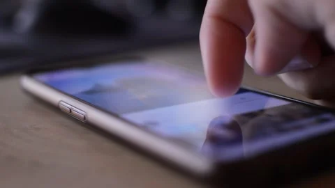 Facebook social network app scroll on a phone display. Video stock 249825121