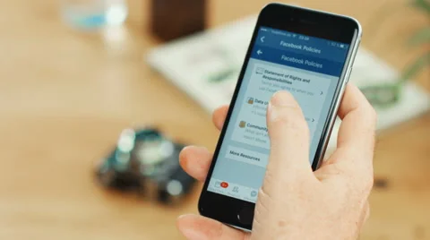 Facebook Terms &amp; Conditions Page on iPhone 6 Stock Footage 64848217