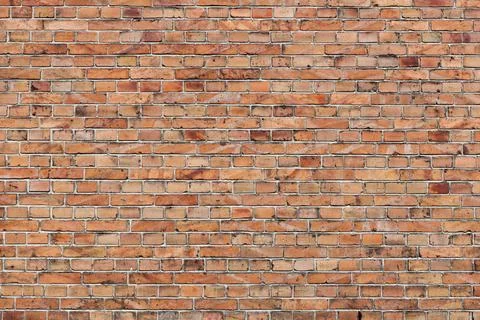 Facebrick brick wall texture Facebrick brick wall texture with pale orange... Stock Photos