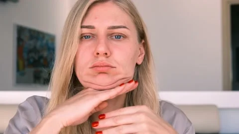 Facebuilding. Double chin problem. Portrait of a young attractive blonde woman 스톡 동영상 165518719