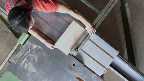 Faceless carpenter working at sliding saw table Stock Footage 182295217