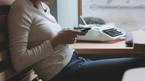 Faceless female using gadget Stock Footage 68947692