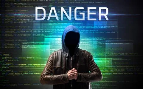 Faceless hacker on code background Stockfoto's