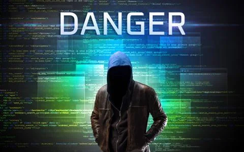 Faceless hacker on code background Stock Photos