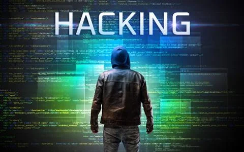 Faceless hacker on code background Foto stock