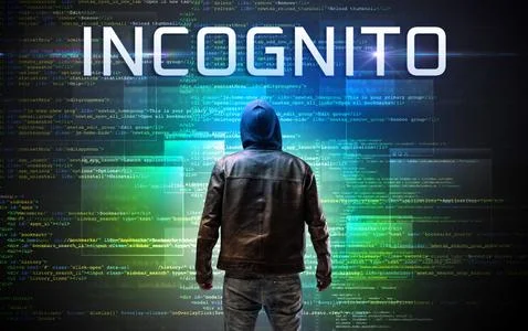 Faceless hacker on code background Foto stock