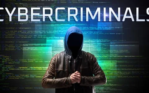 Faceless hacker on code background Stock Photos