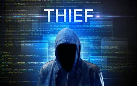 Faceless hacker on code background Stock Photos