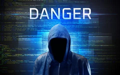 Faceless hacker on code background Foto stock