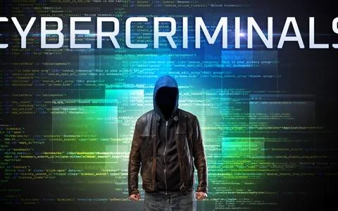 Faceless hacker on code background Stock Photos