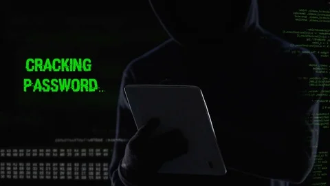 Faceless hacker cracking password and erasing all files database using tablet Stock Footage 84531472