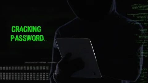 Faceless hacker cracking password and erasing all files database using tablet Stock Footage 84536615