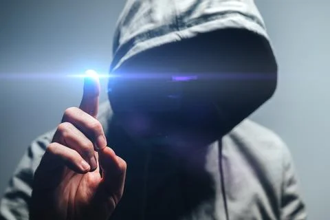 Faceless hooded man touching virtual screen, concept of network security, h.. Stock Photos