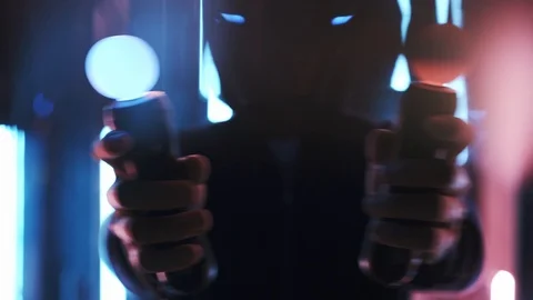 Faceless man playing in VR headset in neon lights Stock Footage 103626827