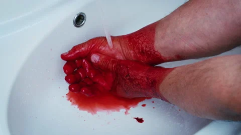Faceless man washing hands from red liquid, blood Stockbeeldmateriaal 201627755