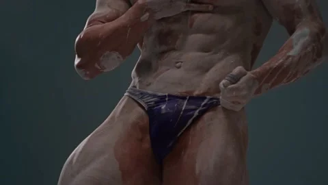 Faceless muscular torso in white clay. Mens briefs on athletic body Stock Footage 221897301
